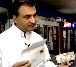 shopkeeper-paid-by-robber.jpg